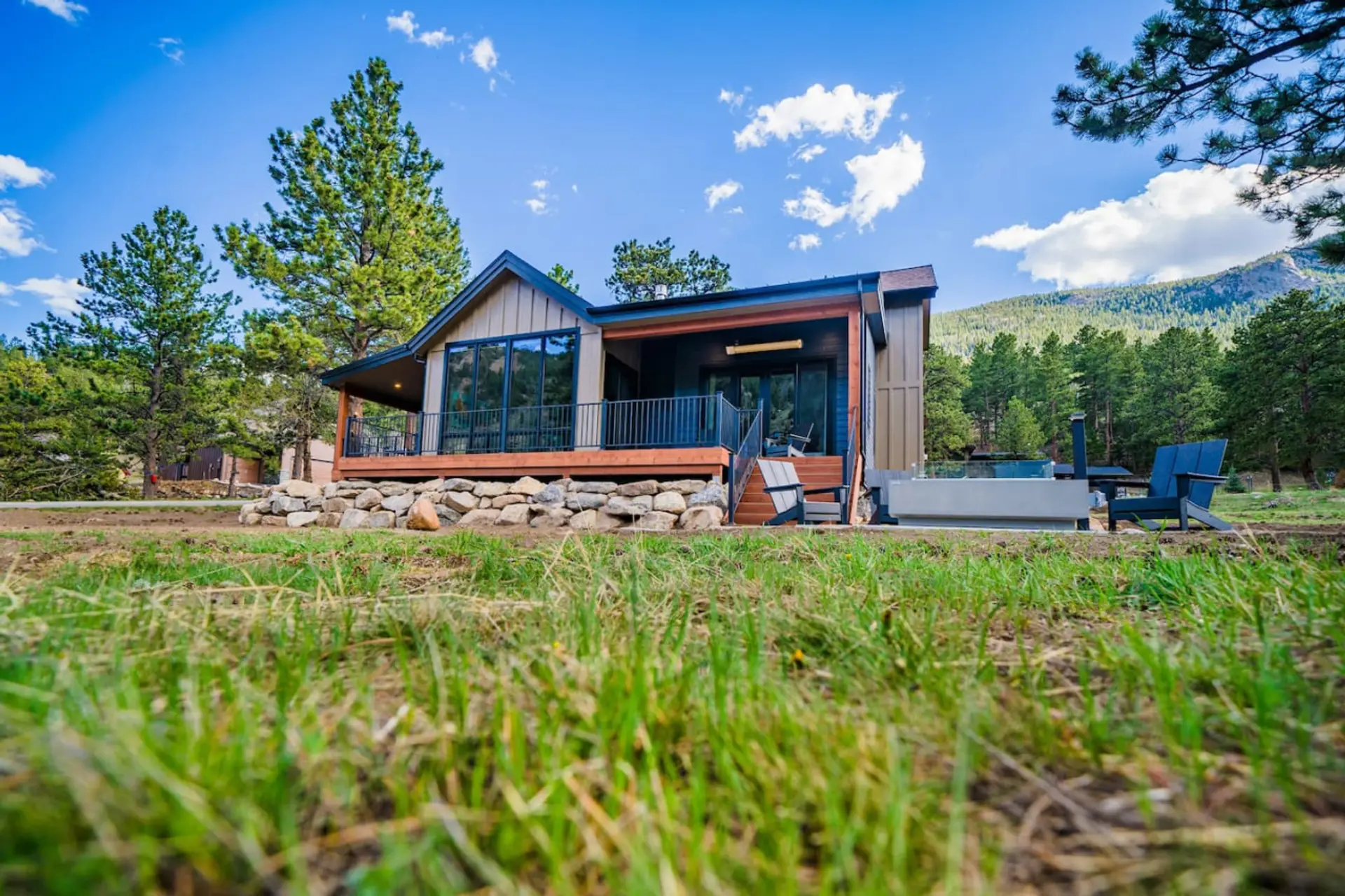 Modern mountain retreat with Rocky Mountain National Park stretching out beyond the backyard.
