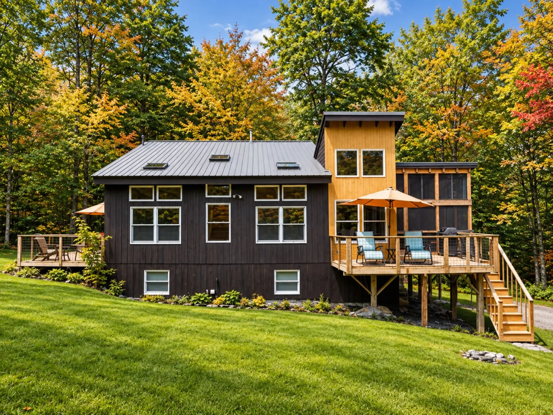 Modern cabin retreat with a spacious deck, outdoor seating, and peaceful forest surroundings.
