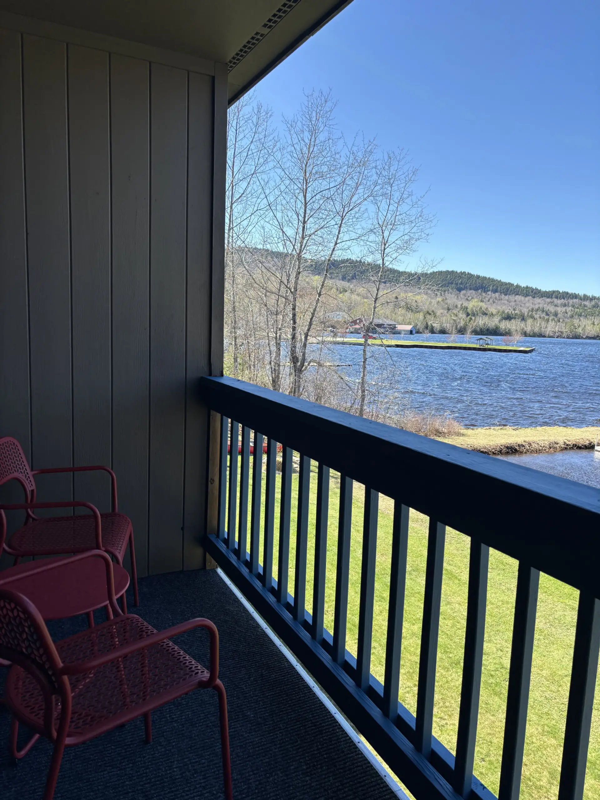 Private balcony with comfortable seating, perfect for enjoying fresh air and a relaxing getaway.