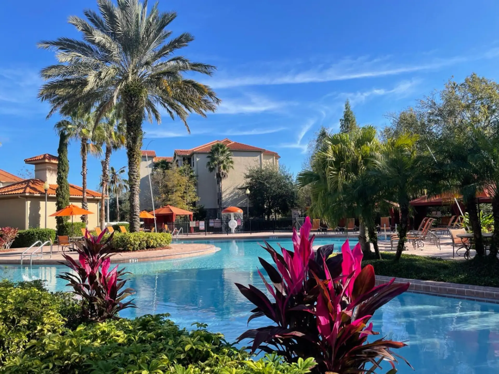 Relaxing pool and hot tub surrounded by lush landscaping. Enjoy a refreshing drink and lunch from the on site bar.