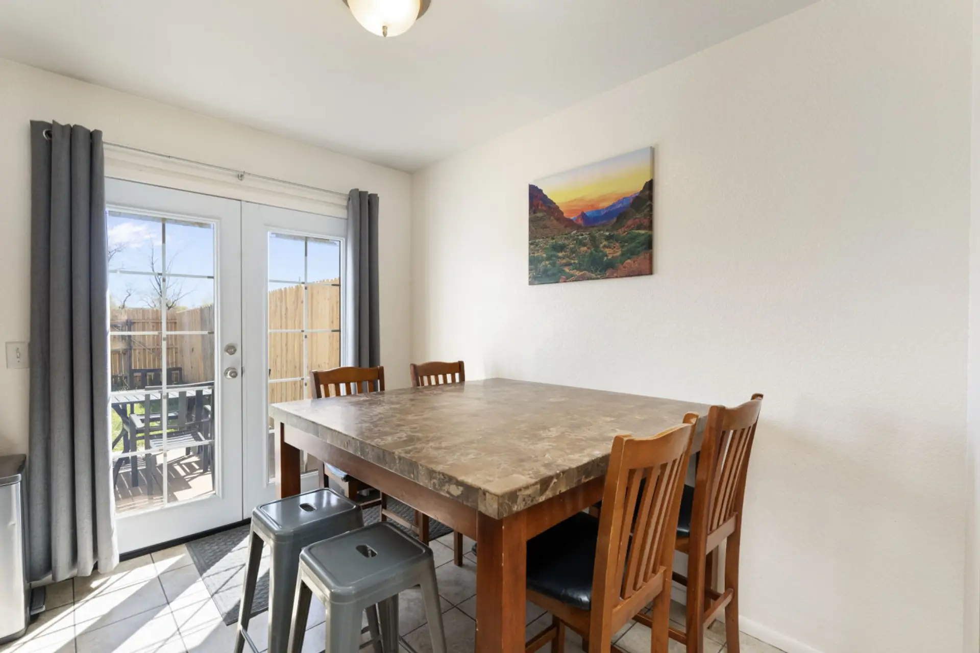 Dining area with backyard access for shared meals, coffee, or trip planning.