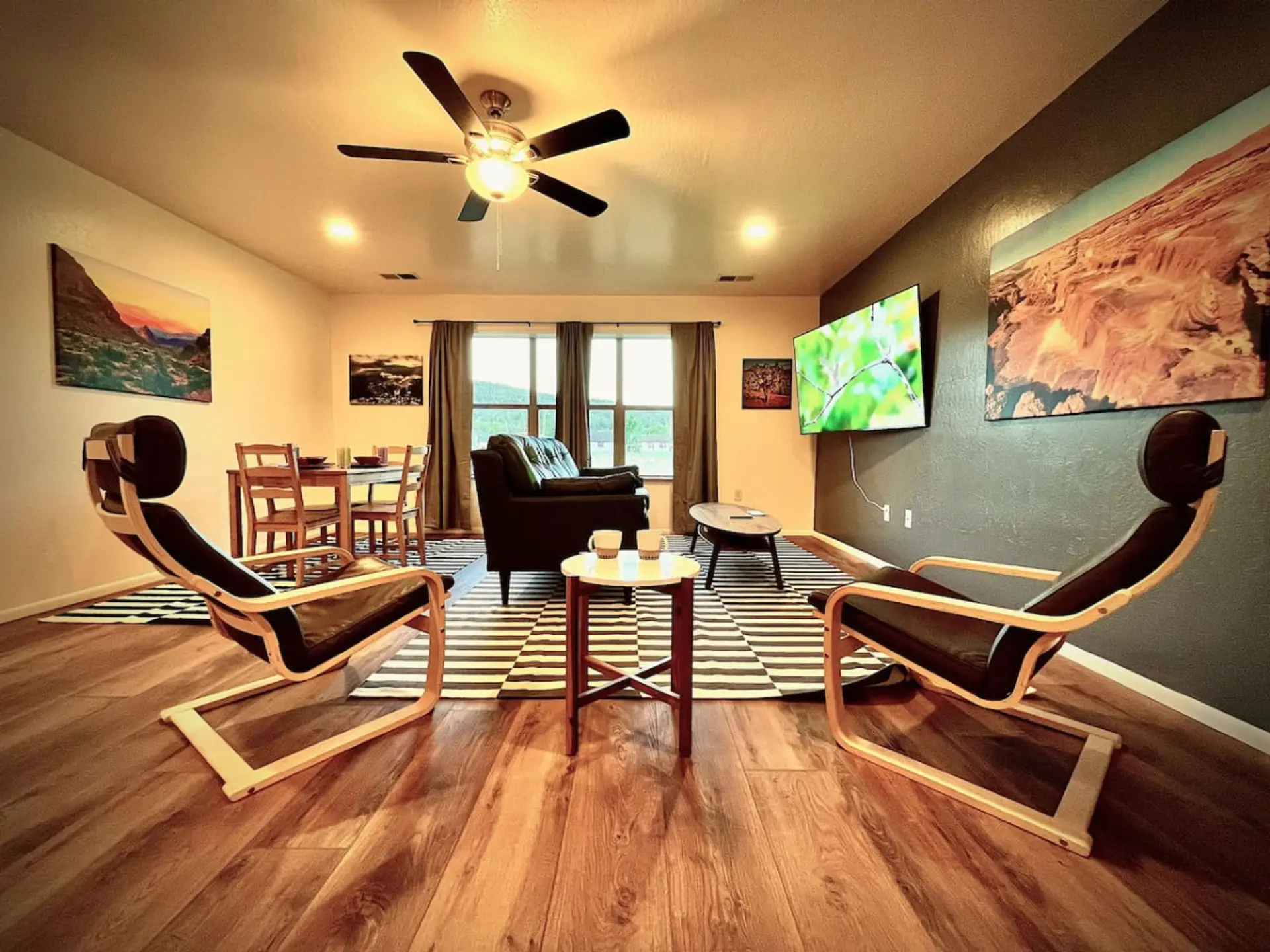 Beautifully remodeled living area with comfortable seating, mountain-inspired art, and space to unwind.