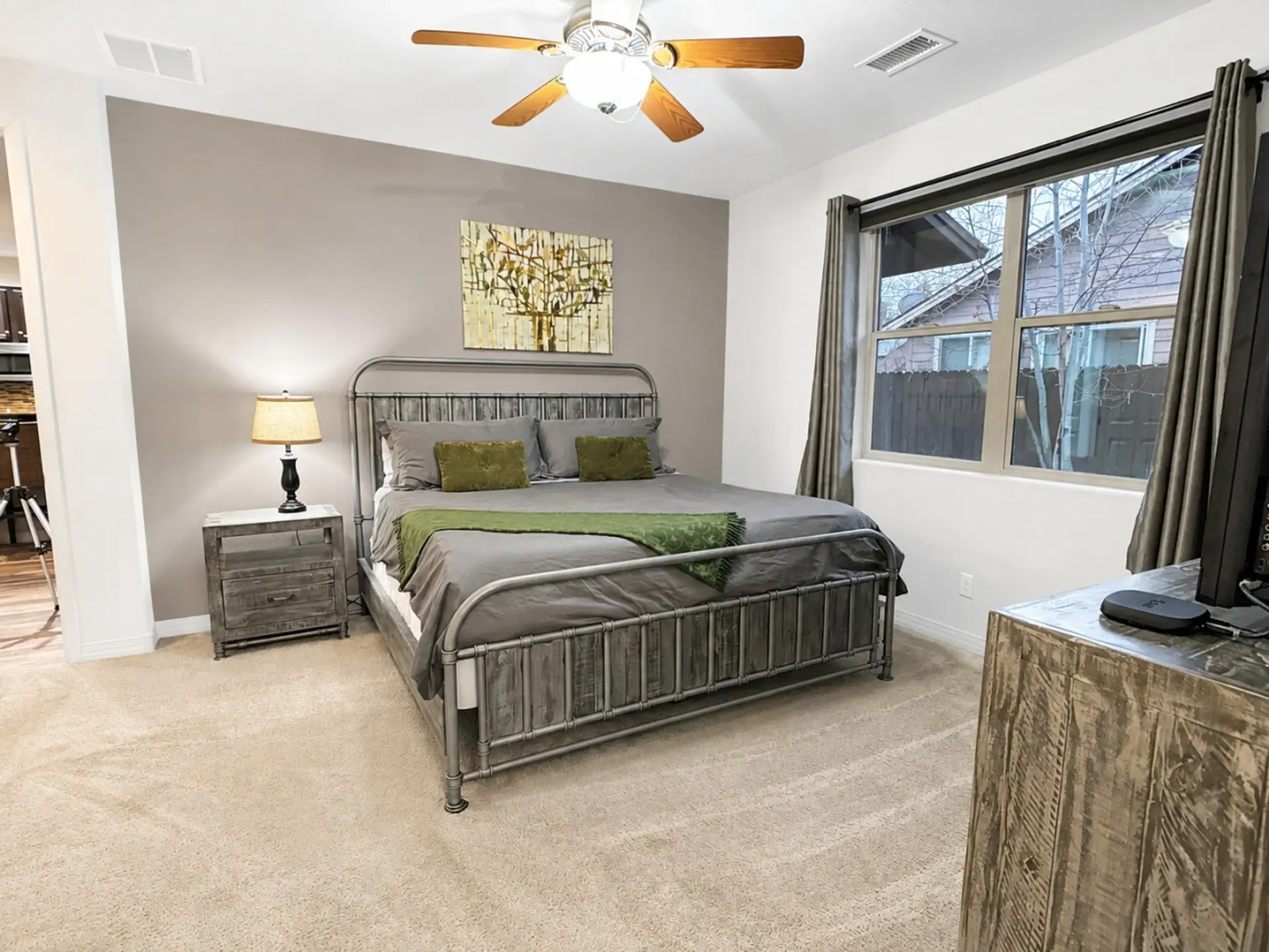 Main-floor king suite with warm mountain style.