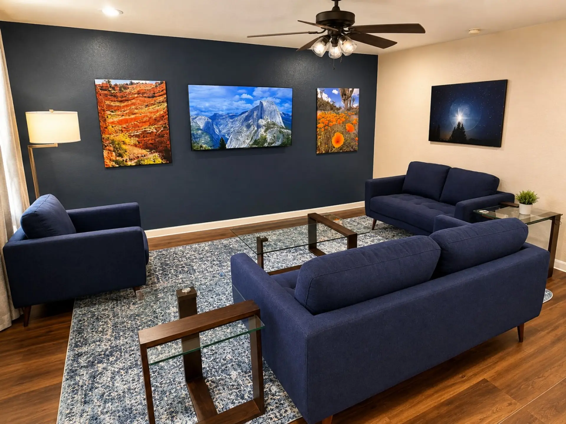 Polished living room with bold accent wall, 65-inch TV, and plenty of seating.