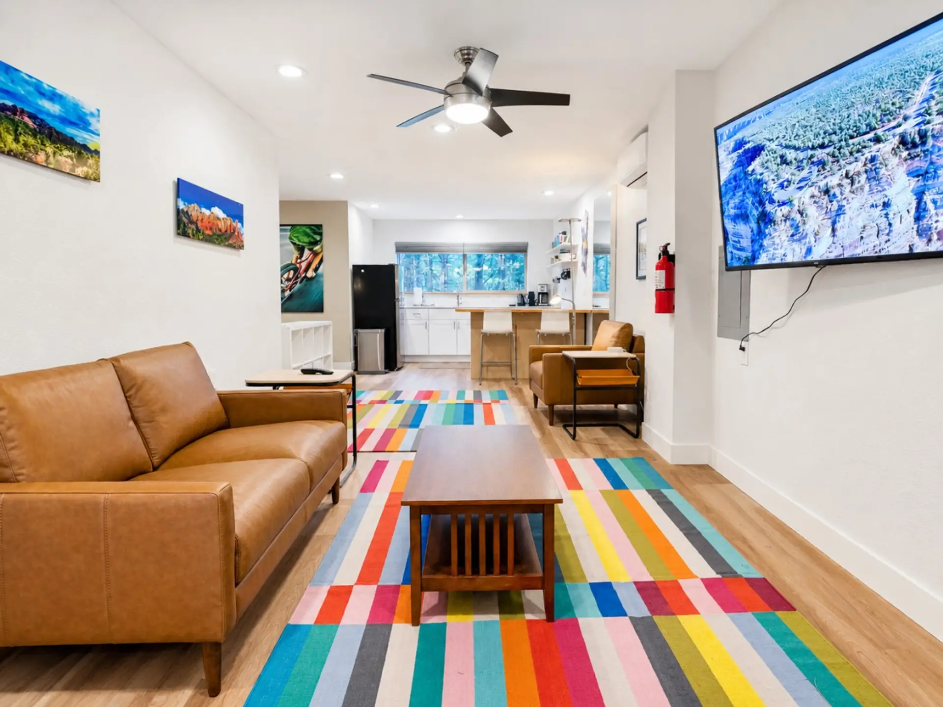 Open studio layout with a comfortable bed, kitchen, and relaxing seating area.