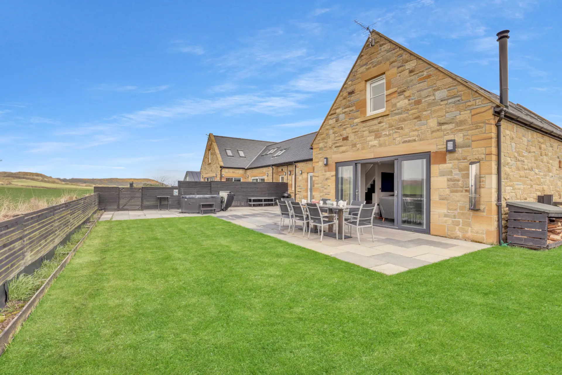 Spacious patio and lawn perfect for outdoor dining