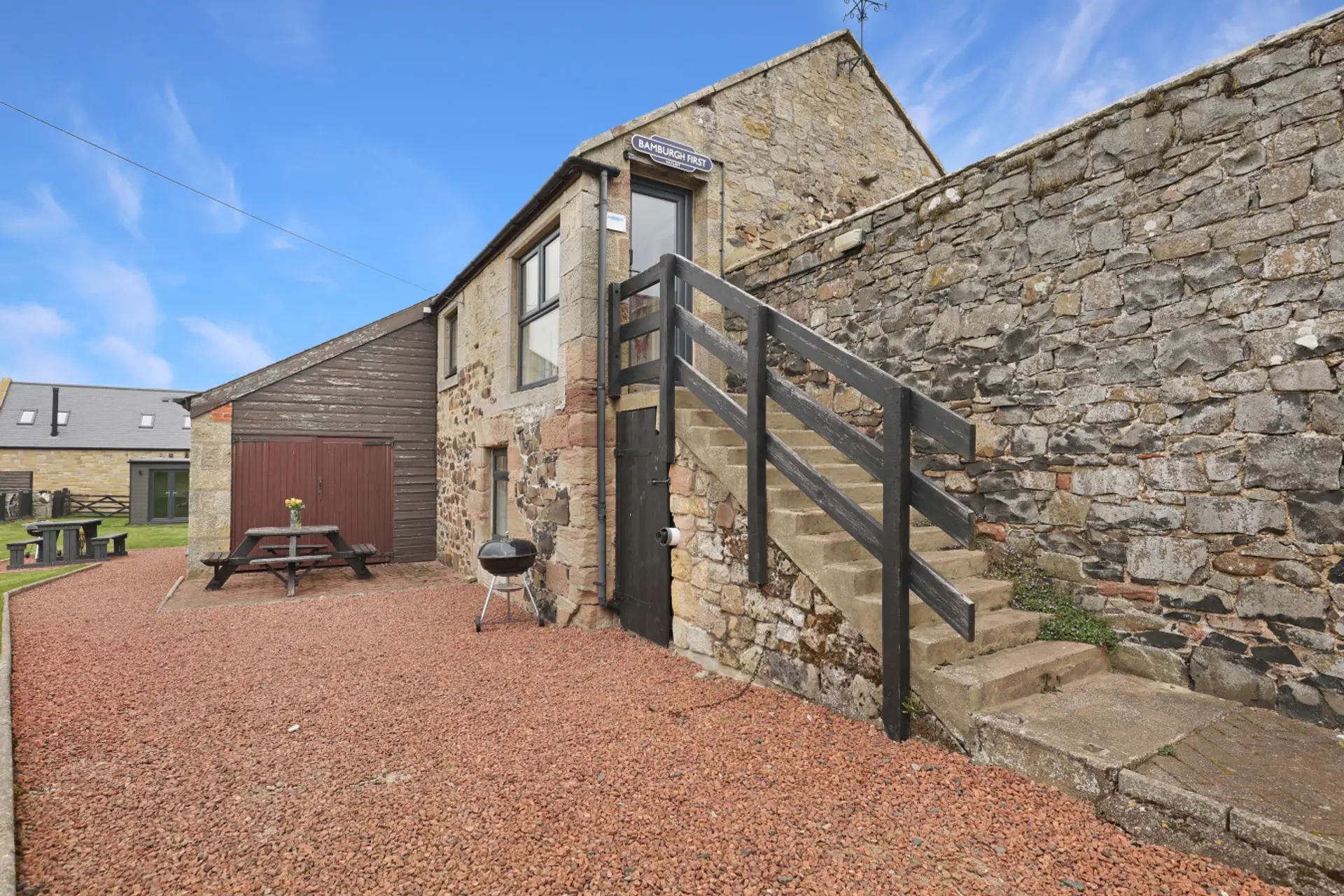 Exterior of Hayloft Cottage with stone staircase access