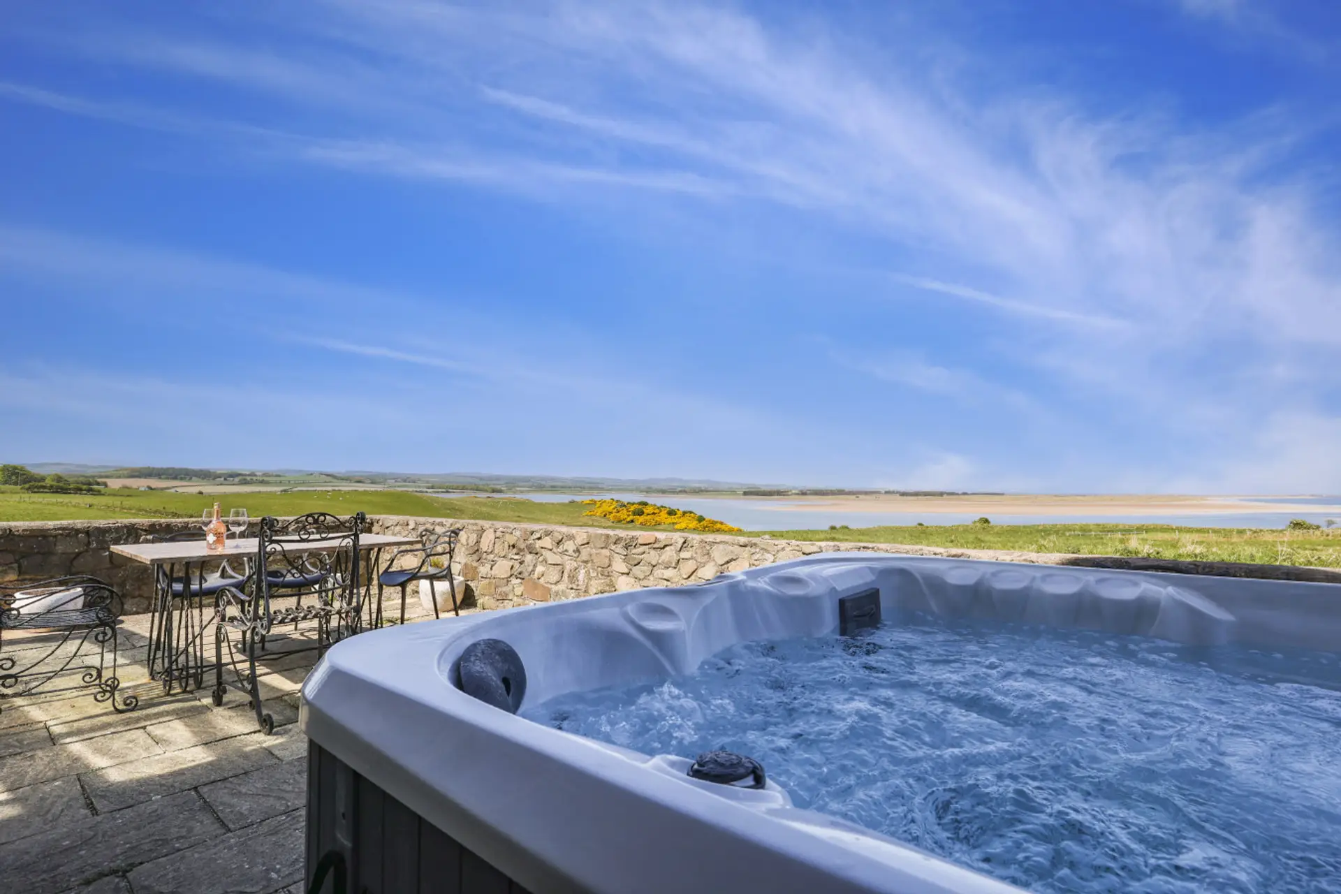 Private hot tub with views across Budle Bay