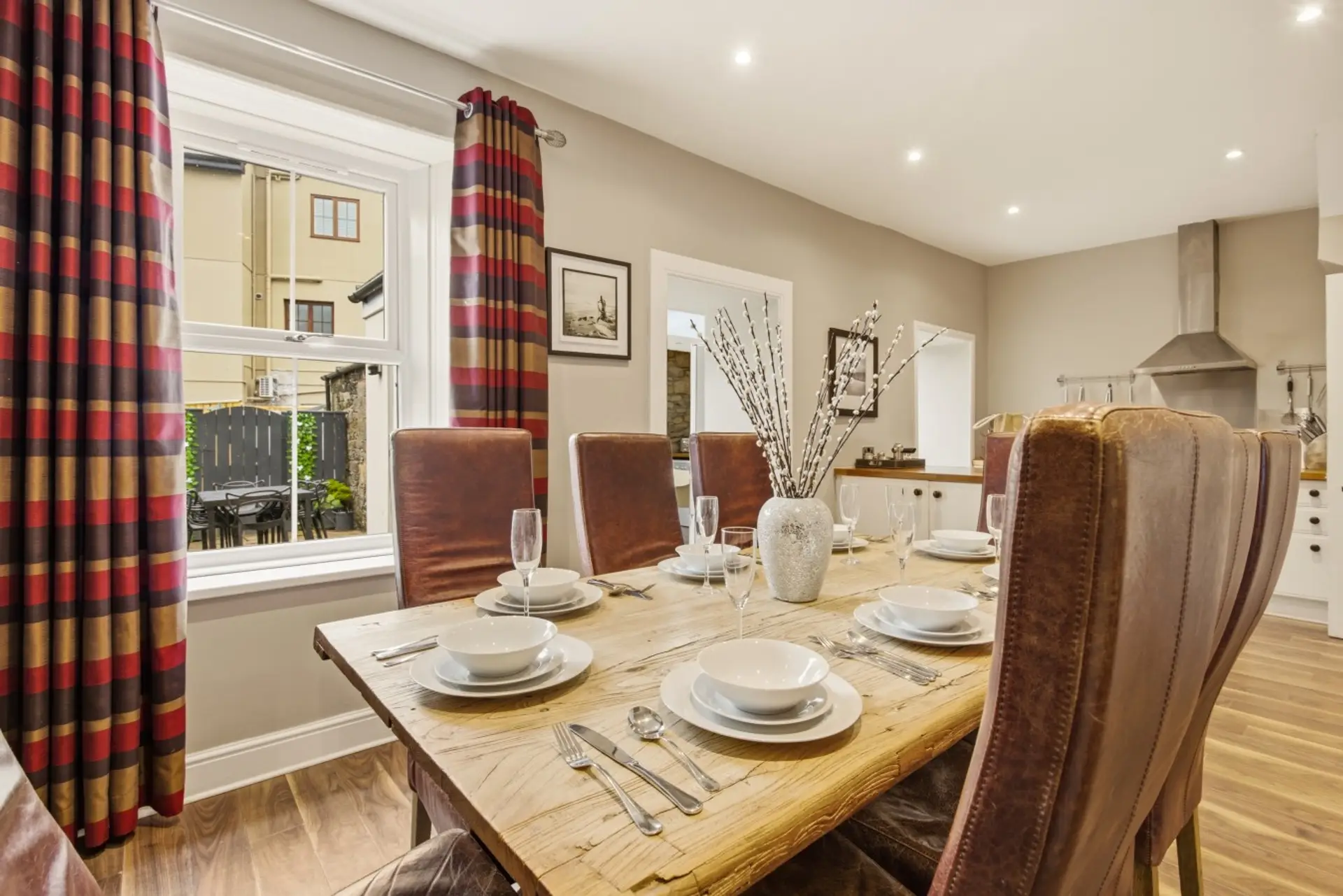 Dining area with table for eight and upholstered chairs