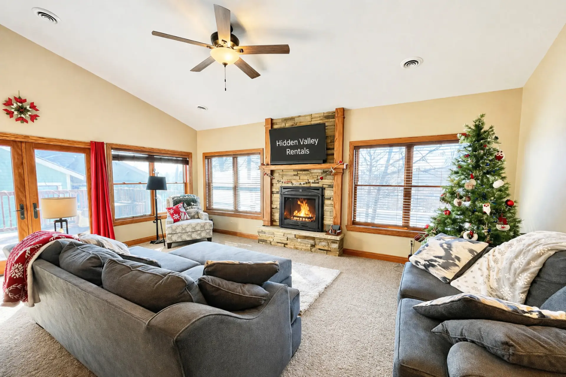Gather in this cozy living area with comfy seating, warm gas fireplace & large windows framing nature’s beauty