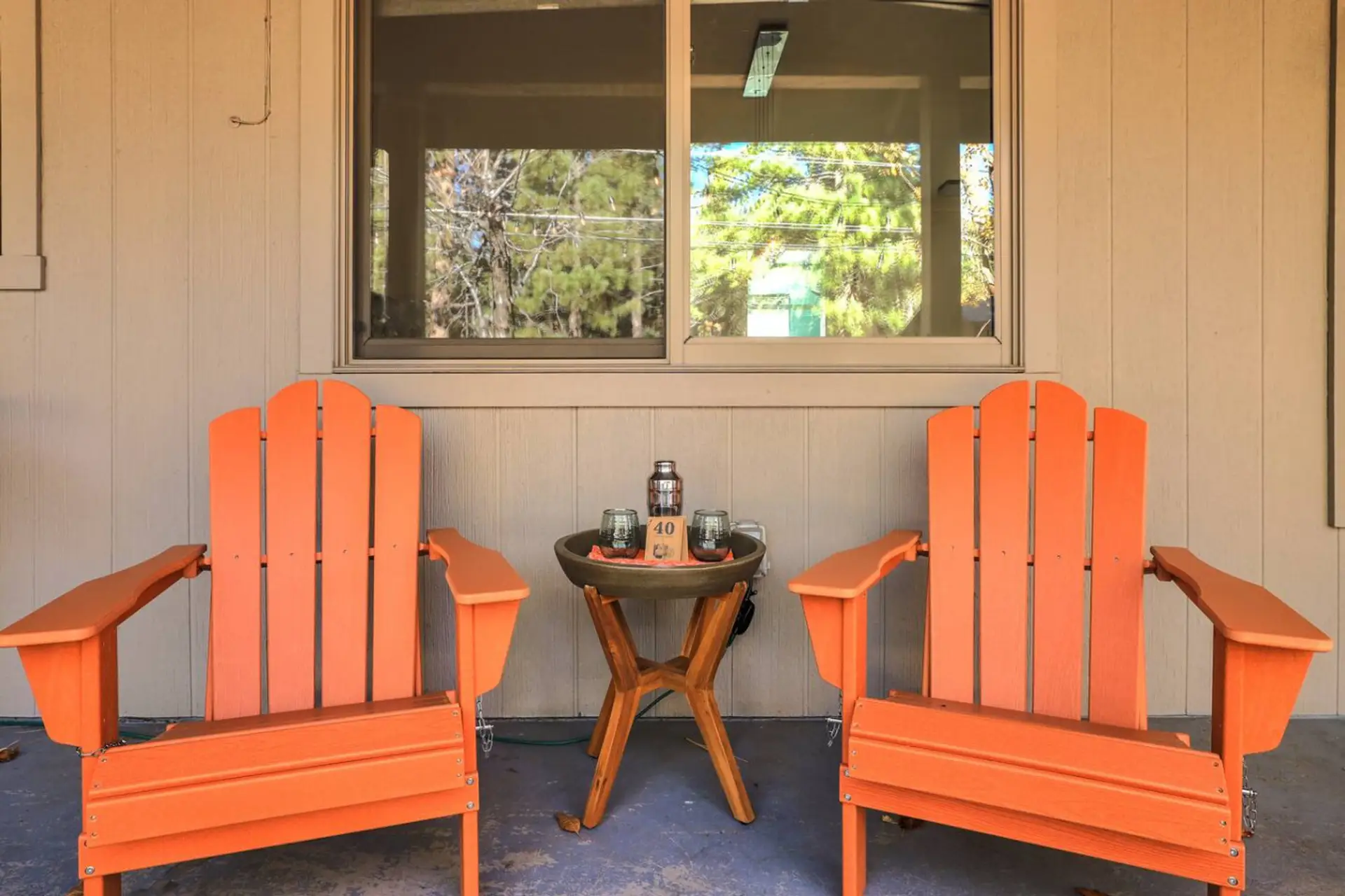 Adirondack chairs under a covered deck