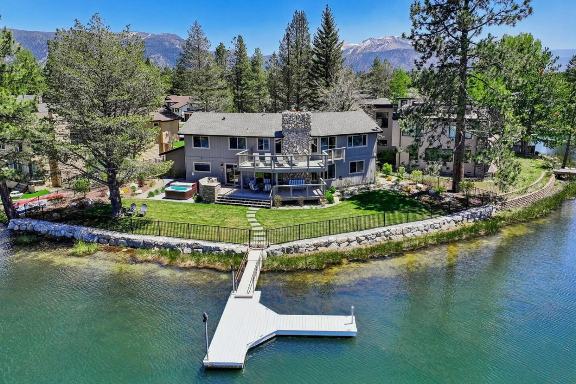 Aerial view from over water/dock behind home