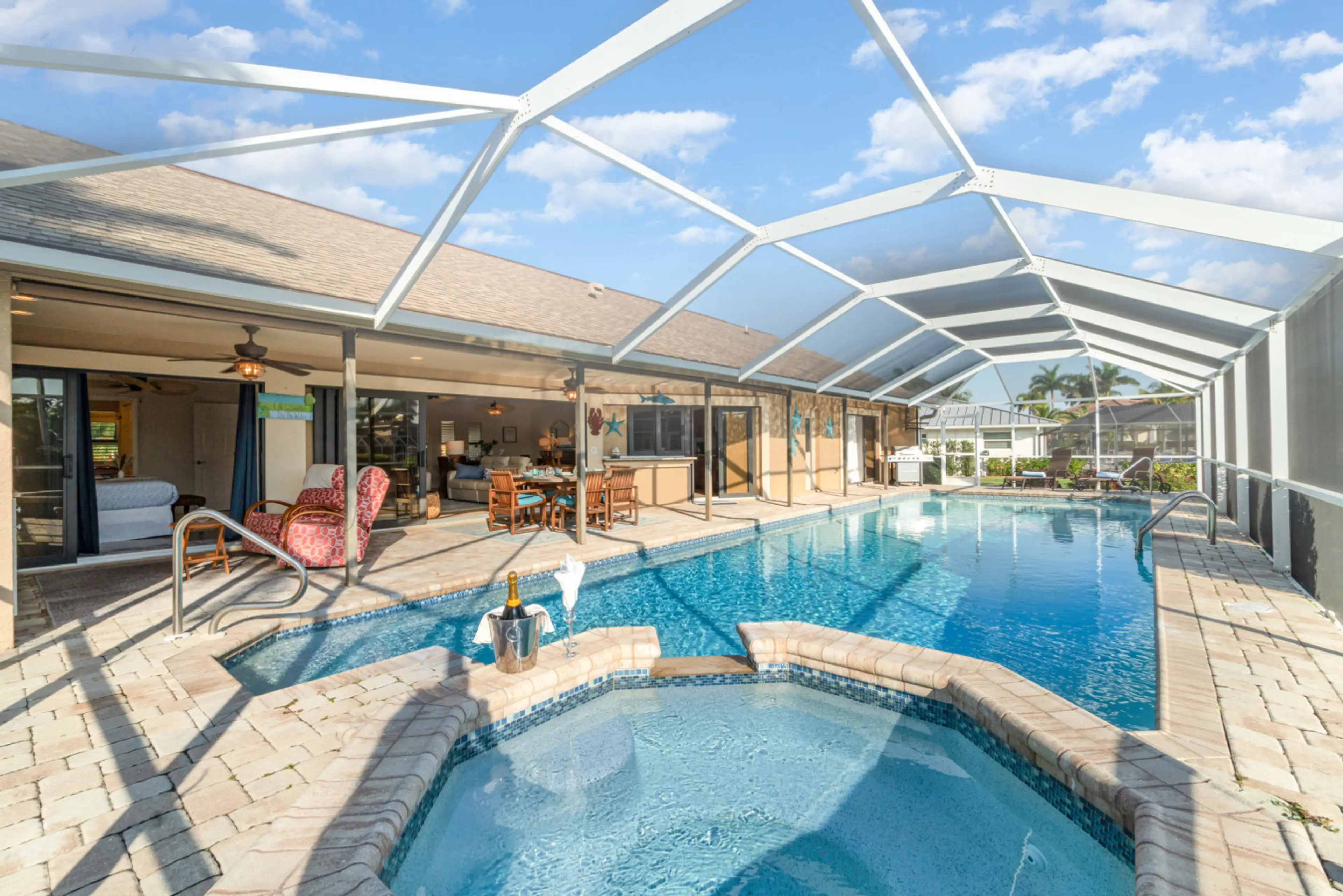 Private waterfront pool & spa with expansive screened lanai — your front-row seat to relaxation.