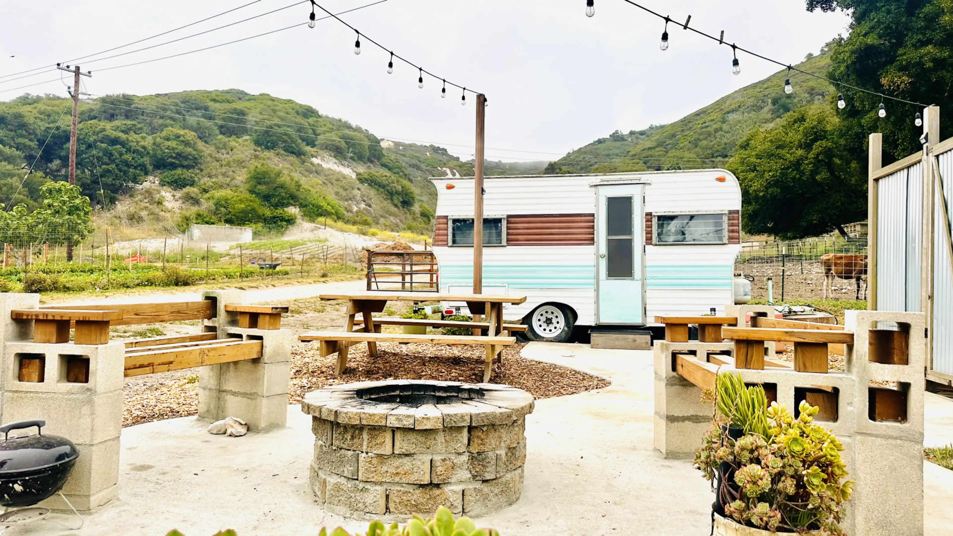 1964 Northwest Deluxe Camper, remodeled in a Southwestern feel, with an outdoor shower, firepit, picnic table and gorgeous views of the 40-acre working farm.