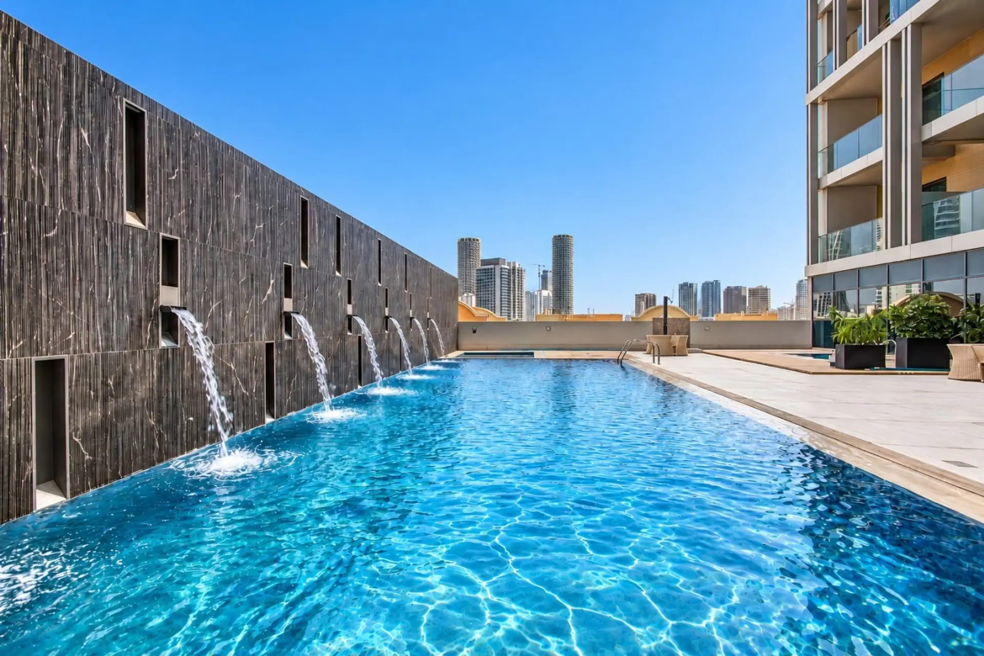 Outdoor pool with space to relax and enjoy the sun