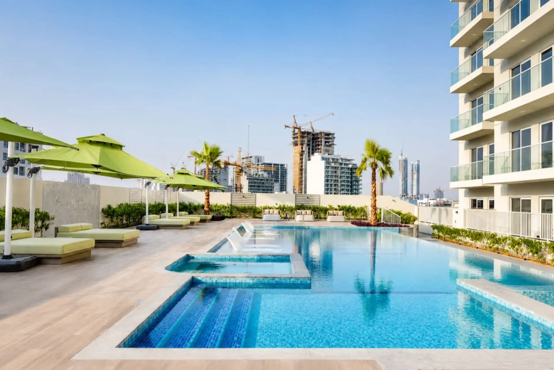 Pool area with comfortable sun loungers and sunshine