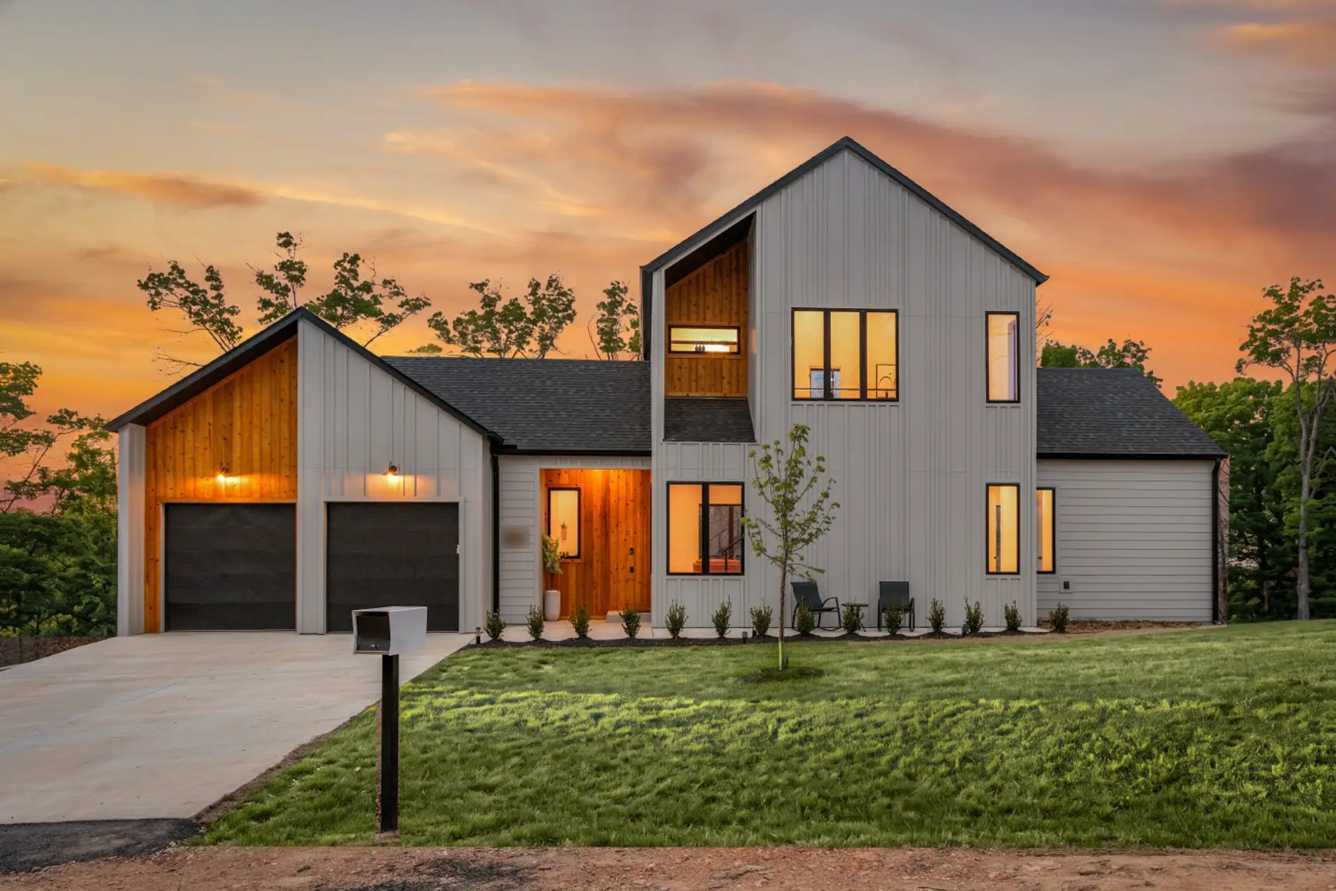 Modern exterior view of Freetime Chalet at sunset.