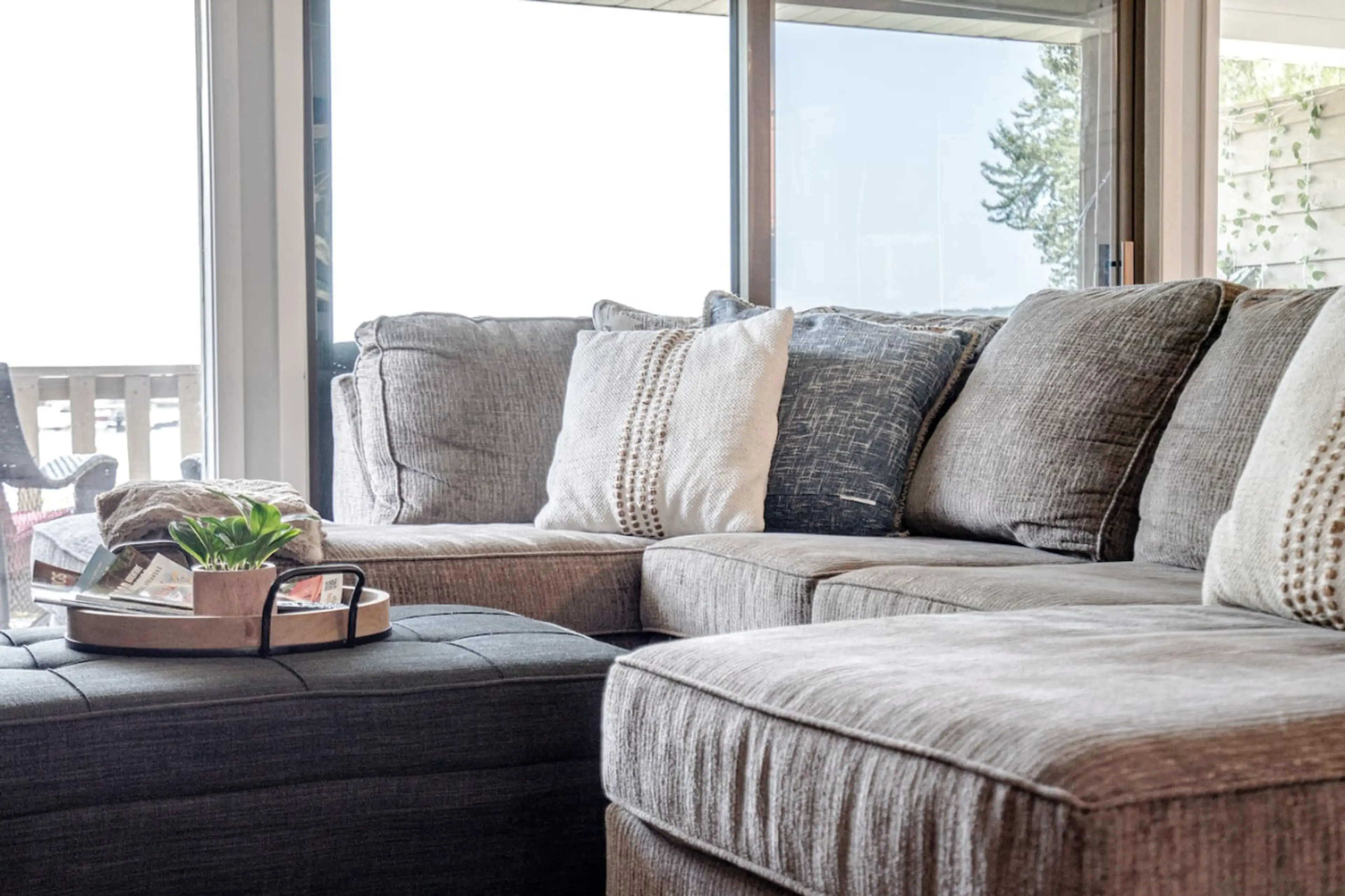 Comfortable sectional sofa with soft pillows – a perfect spot to unwind with family or friends.