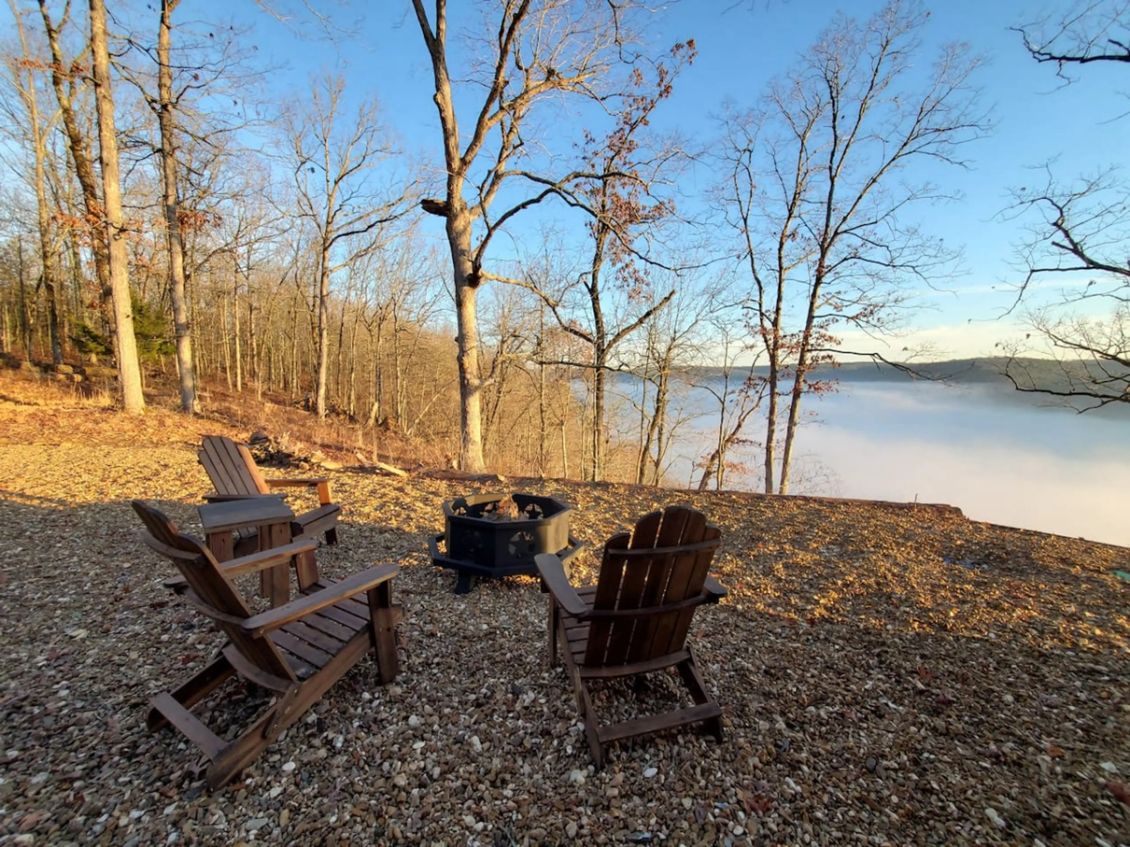 Unwind by the firepit while overlooking the misty lake and peaceful woods.