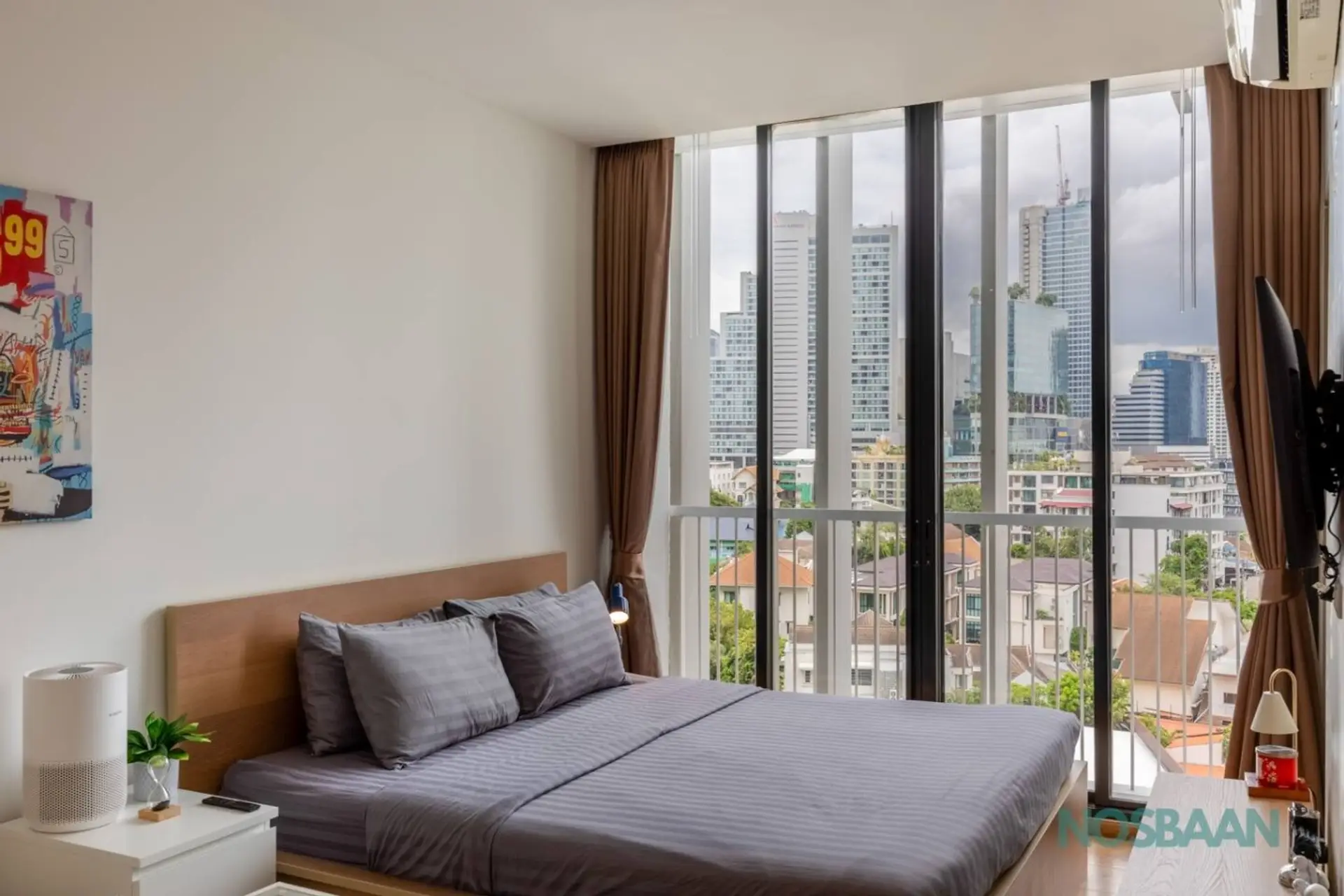 Queen-sized bed with city views, 44" HD Smart TV, and air purifier
