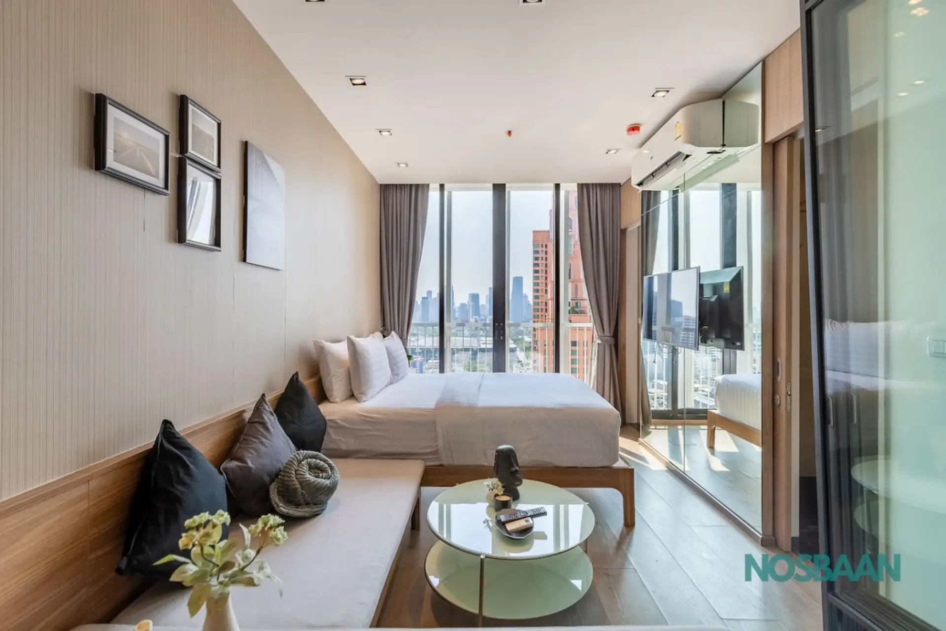 Queen-sized bed with city views, 44" HD Smart TV, and air purifier