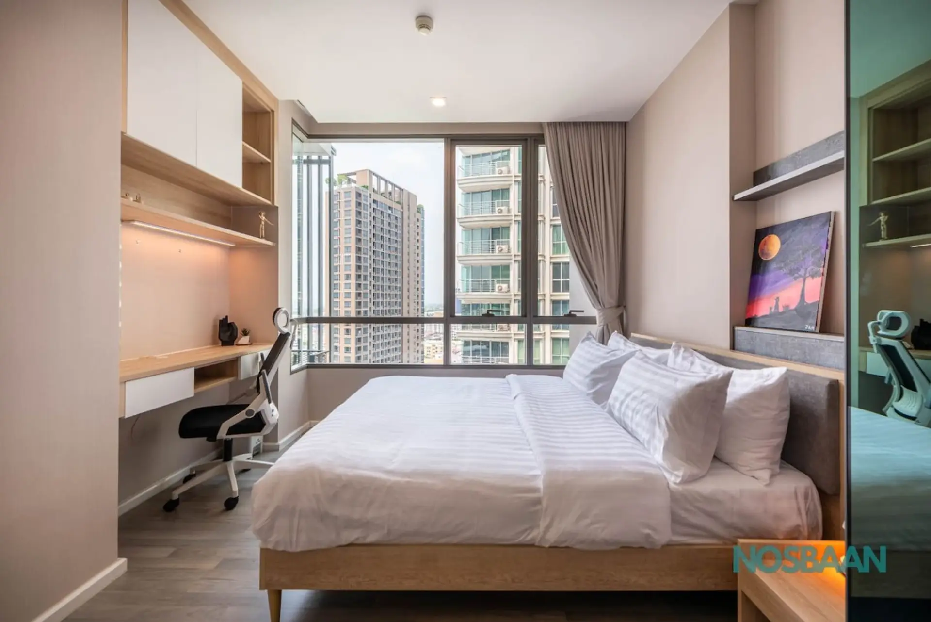 Queen-sized bed with city views and air purifier provided