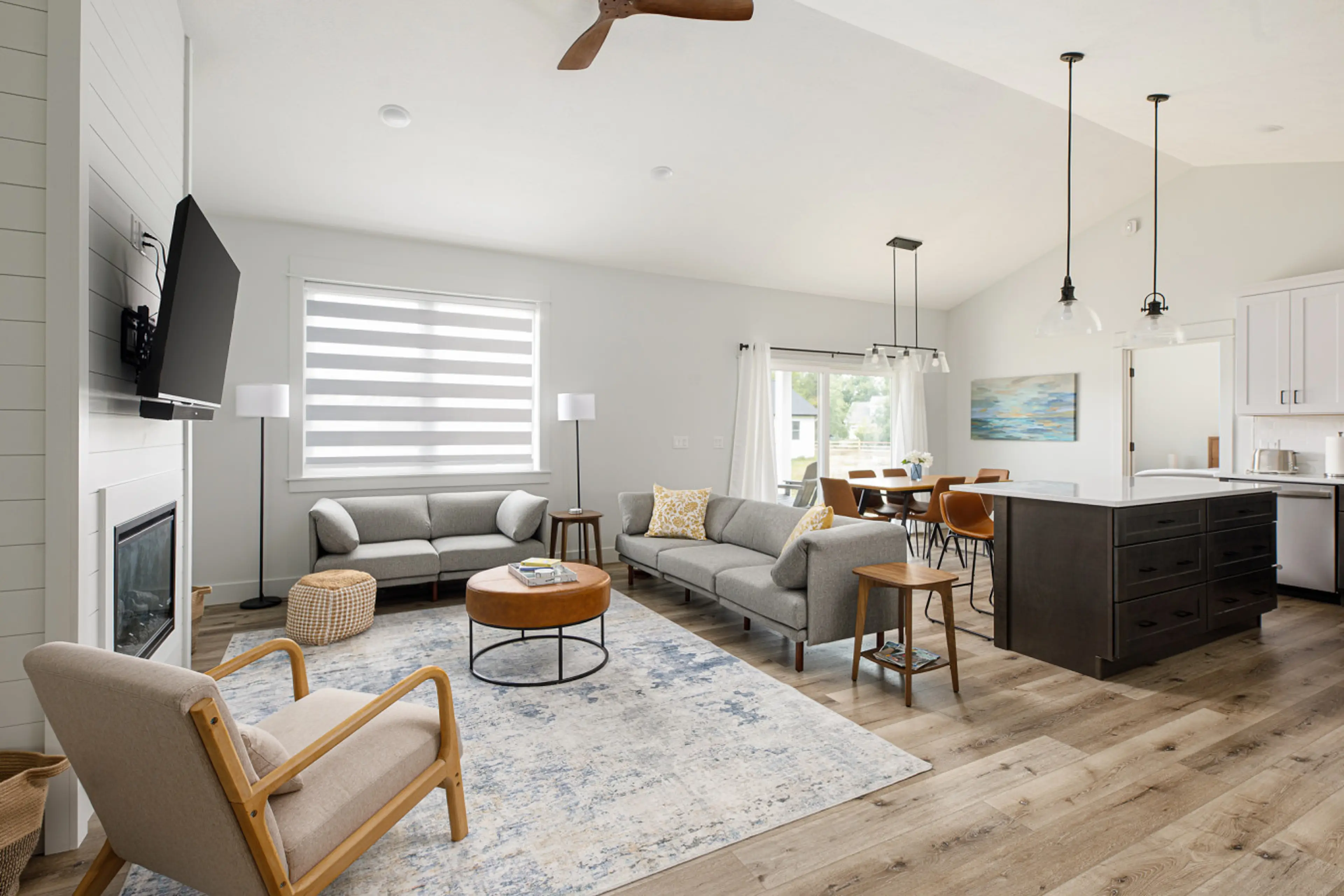 A warm, homey view from the living room to the kitchen and dining space