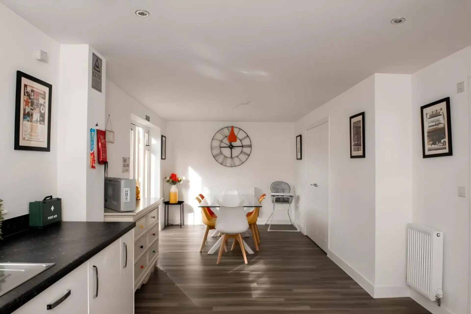 Enjoy meals in a sunlit, modern open-plan kitchen with a dedicated dining space.