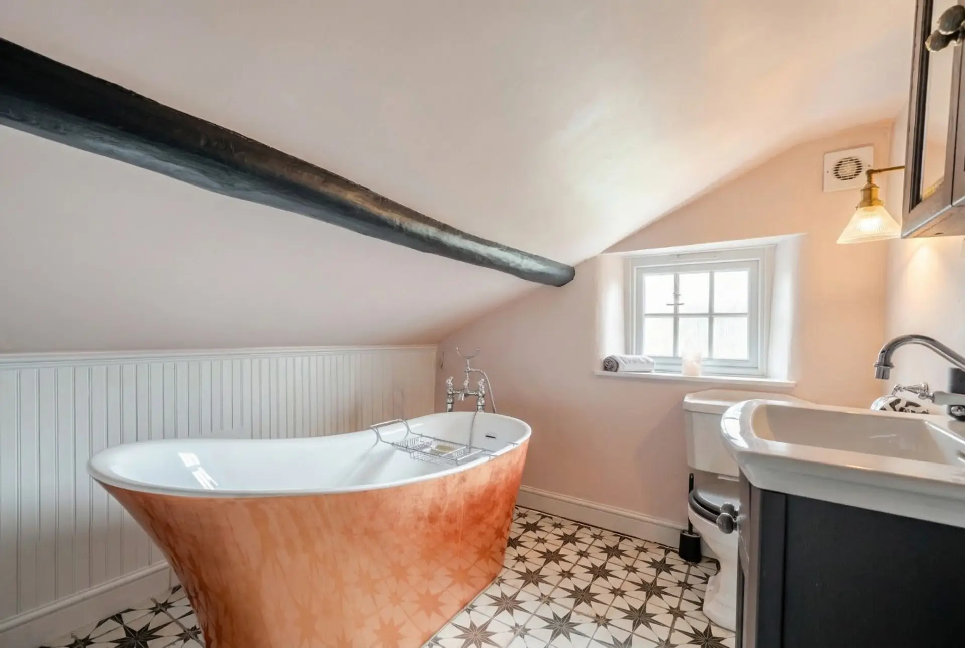 Soak in the copper freestanding bath under original beams for a truly indulgent stay.