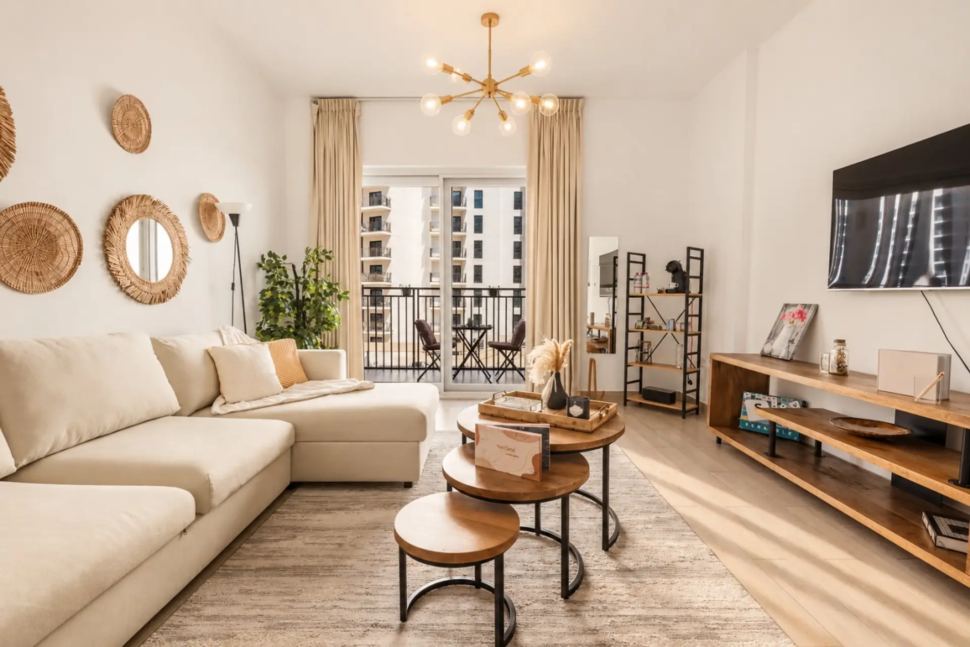 Bright living room with comfortable seating and direct access to the private balcony.