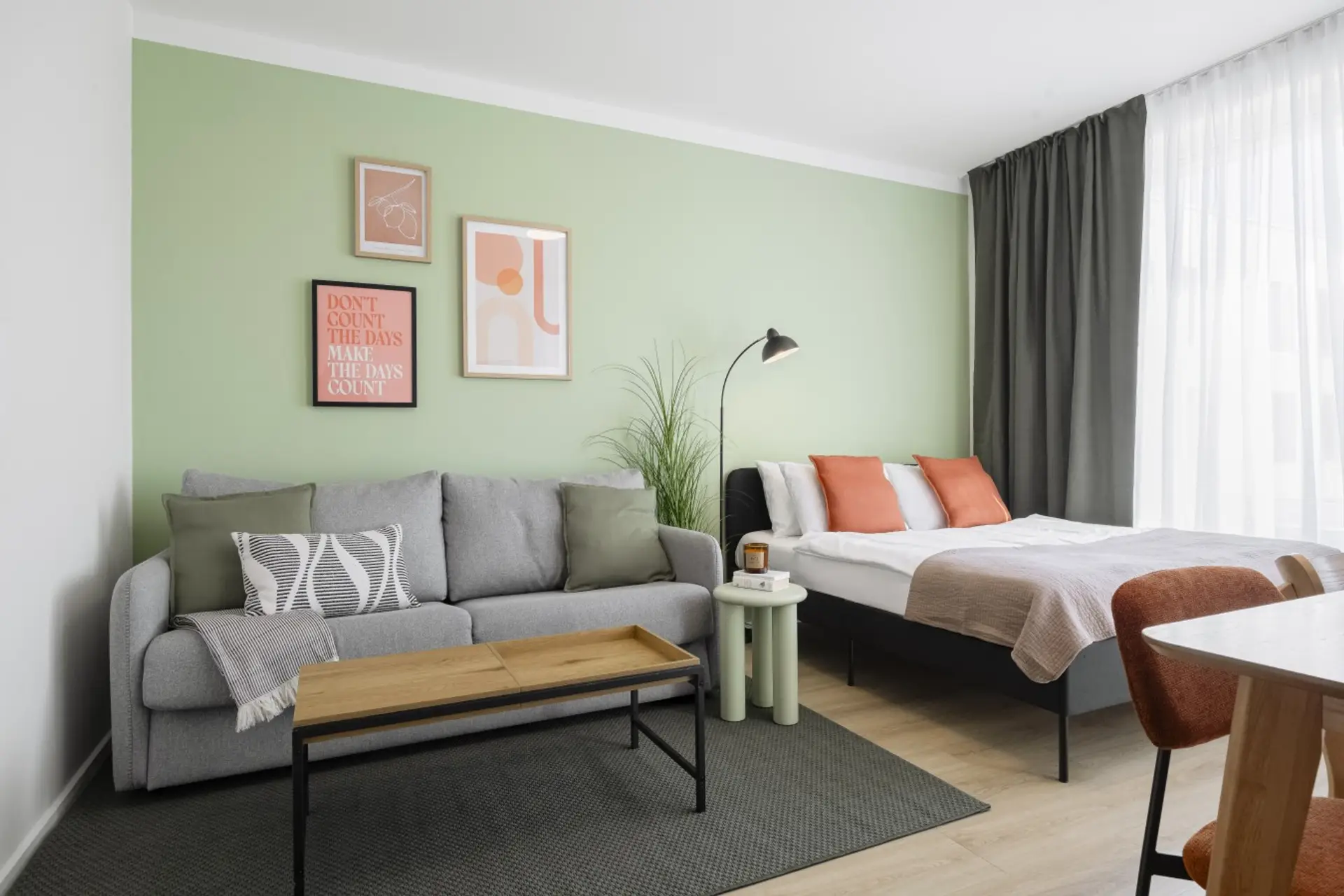 Stylish second bedroom area featuring a king-size bed and sofa bed