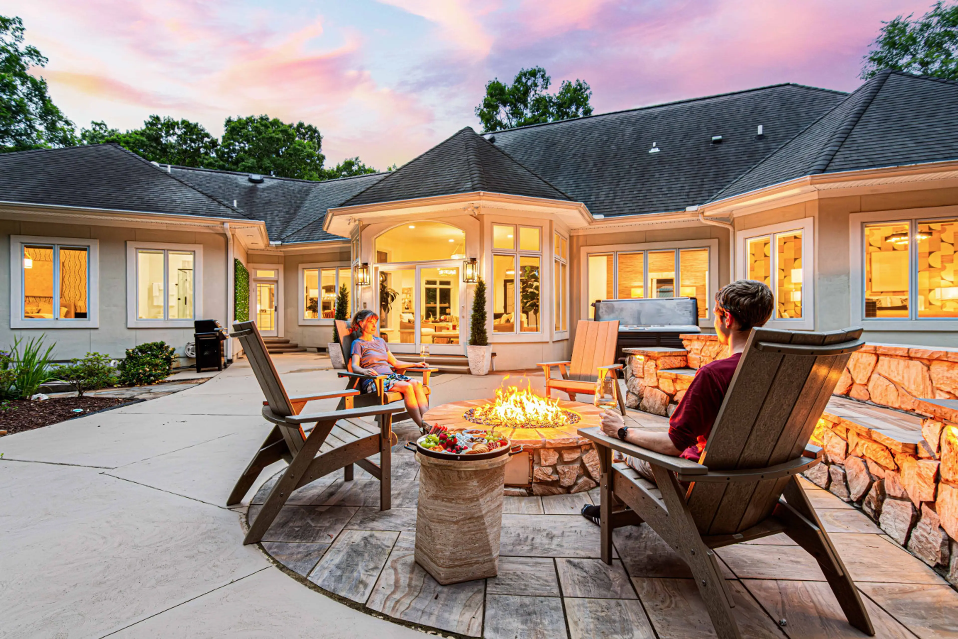 Enjoy our expansive backyard with firepit, hot tub, outdoor dining, cornhole, and more.