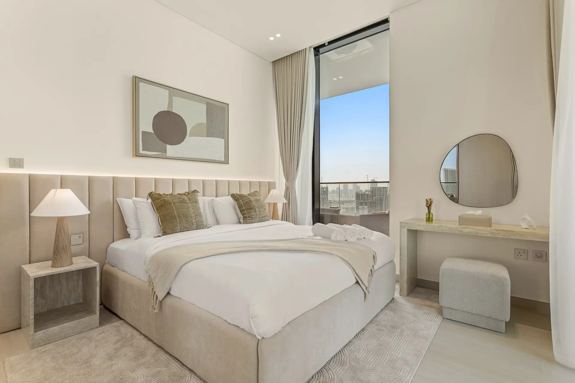 Bedroom: Relax in our serene bedroom, featuring a king-size bed with plush linens and a vanity table for your convenience.