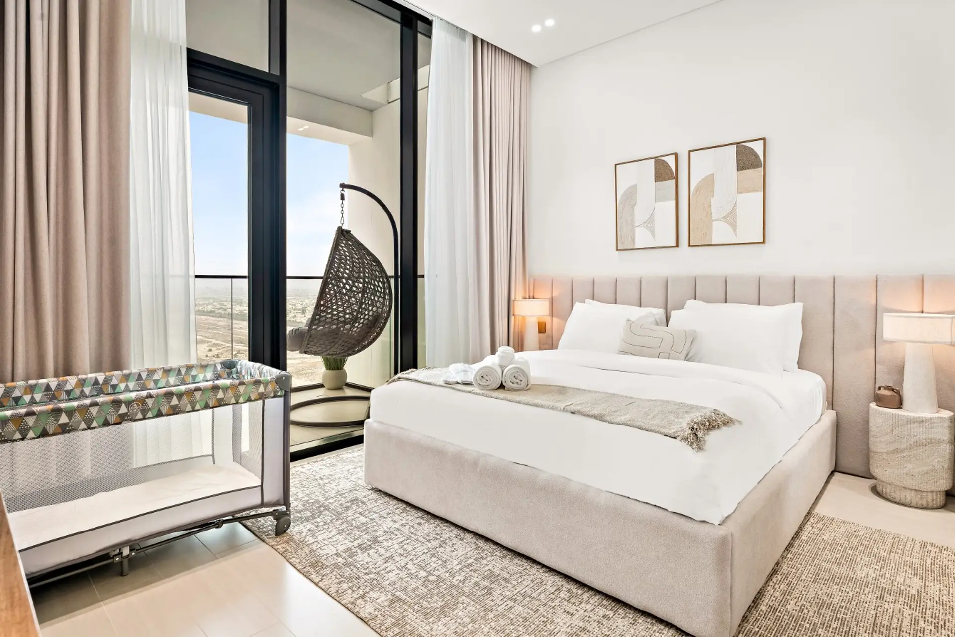 Bedroom: Relax in our serene bedroom, featuring a king-size bed with plush linens, a vanity table for your convenience, and a baby crib for your little ones.