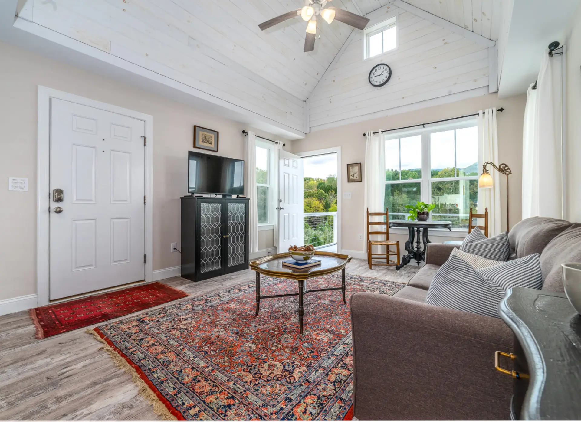 Comfortable living room with great lighting and a flat-screen TV for your entertainment.
