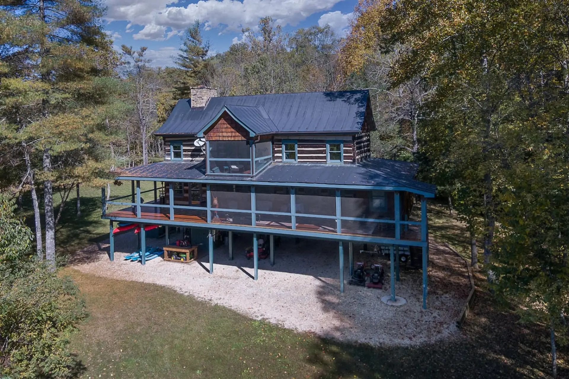 Experience the Beauty Before You Arrive – Aerial View of the Property’s Front and Natural Setting