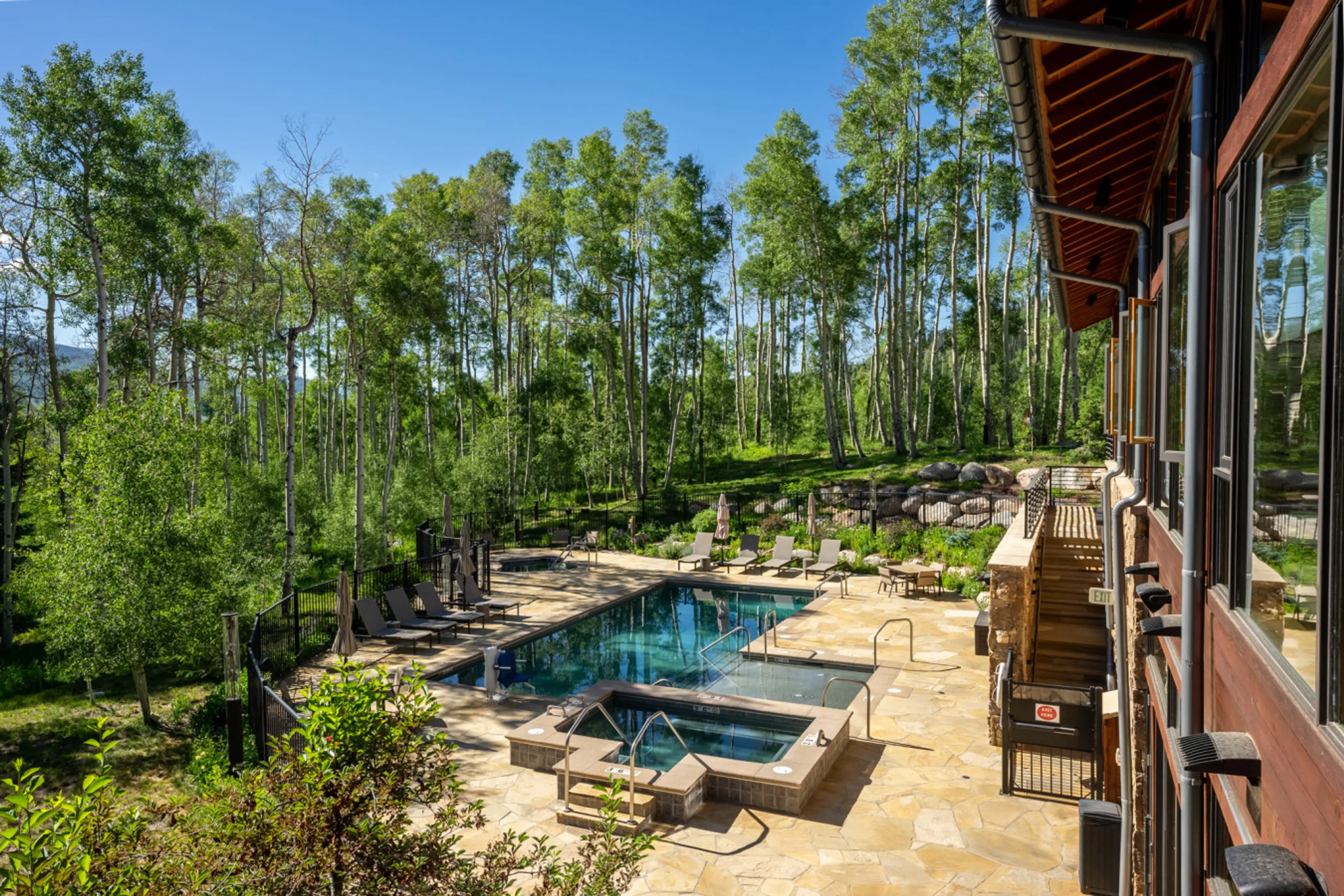 Shared heated pool and hot tubs at The Aspen House Clubhouse - Open all year!