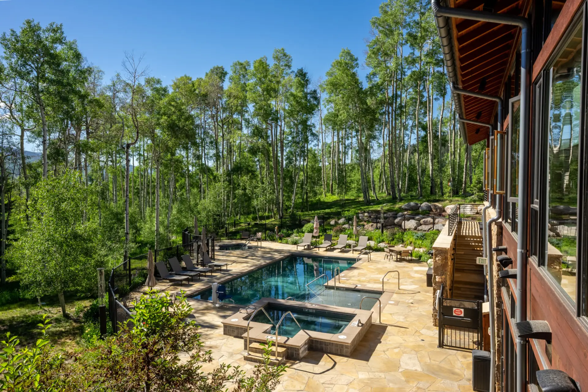 Shared heated pool and hot tubs at The Aspen House Clubhouse - Open all year!