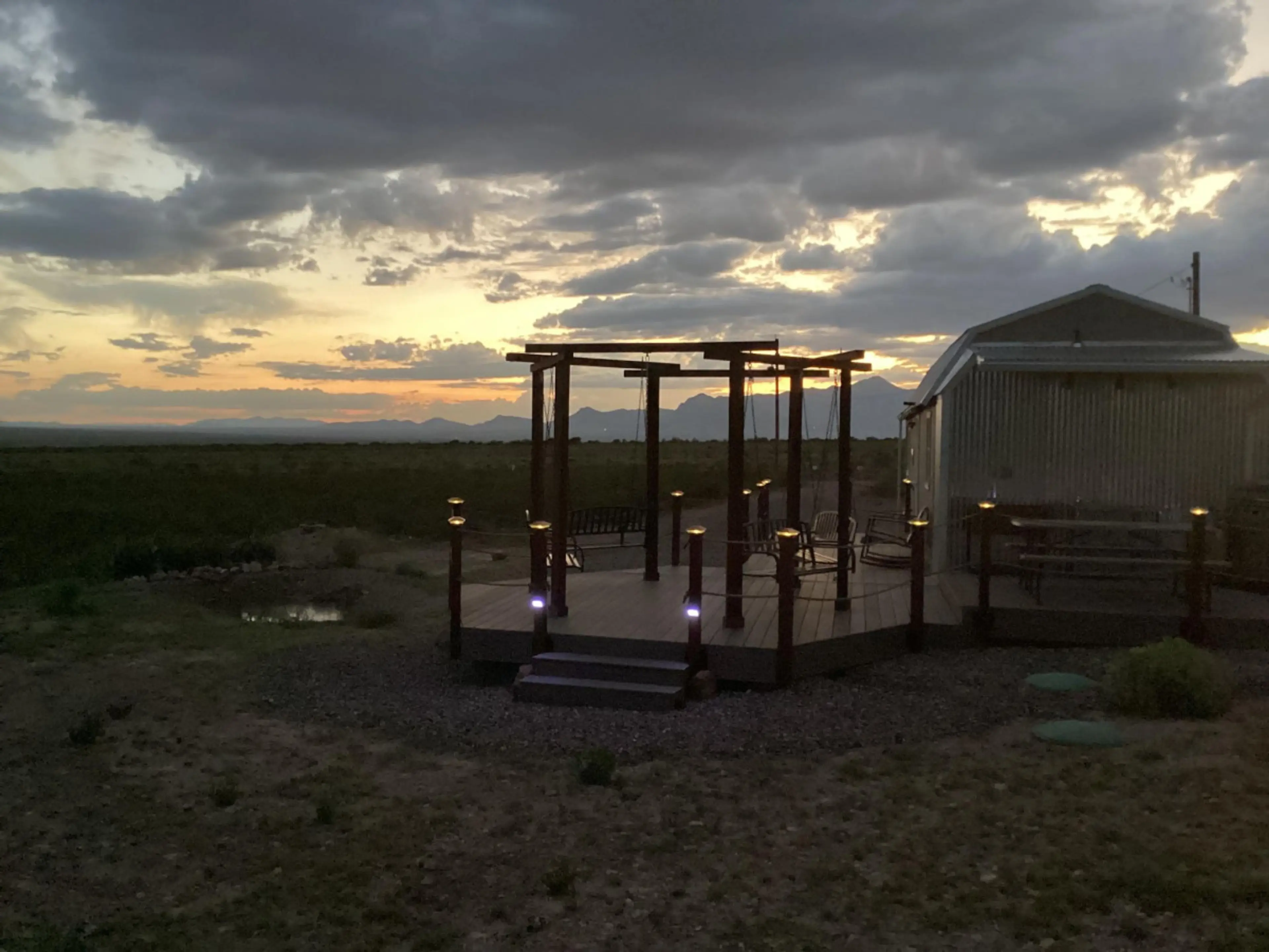 Tiny Home Cabin with huge deck / patio  overlooking mountains during sunset